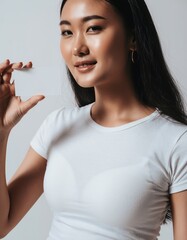 Beautiful Asian Woman Holding Blank Business Card Mockup