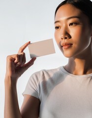 Beautiful Asian Woman Holding Blank Business Card Mockup
