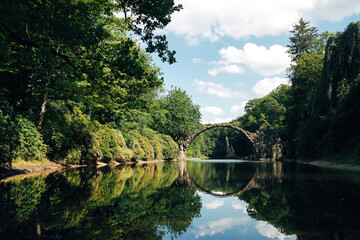 Iconic Rakotz Bridge Reflection Creating Perfect Circle in Summer, Kromlau Park Fairytale Landscape