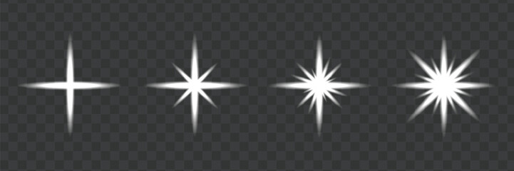 Set of four white sparkle light effects on dark transparent background