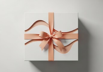A white gift box with a peach ribbon tied in a bow, presented from a topdown perspective on a plain white background