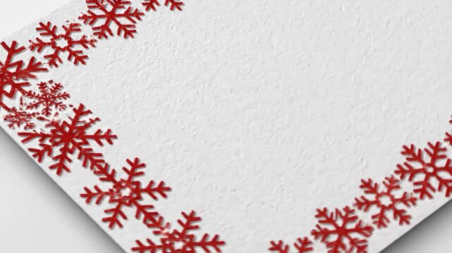 Decorative snowflake border on textured white surface with copy space