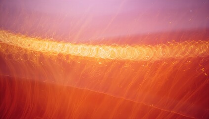 Glowing wide gold bokeh band with cascading orange light trails in long-exposure abstract scene