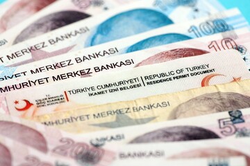 Turkey residence permit card document and turkish liras money bills banknotes. Permanent resident card in Turkiye