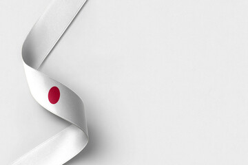 Japan flag ribbon on white background with copy space