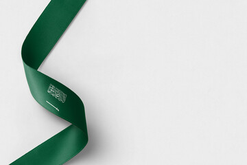 Saudi Arabia flag ribbon on white background with copy space