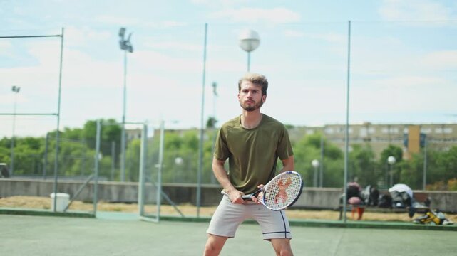 Professional tennis player serving during match on court