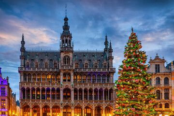 Naklejka na ściany i meble A beautiful decorated Christmas Tree at the Grand Place in Brussels, Belgium, during dusk for the festive season