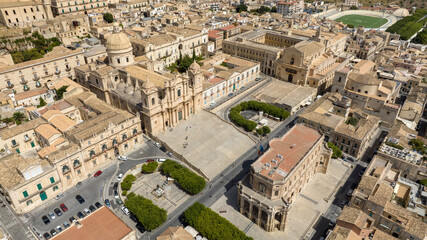 Fototapeta premium Aerial view of the historic center of the city of Noto, in the province of Syracuse, Sicily, Italy. At the center of the town is the historic center with the Cathedral of San Nicolò and the Town Hall.