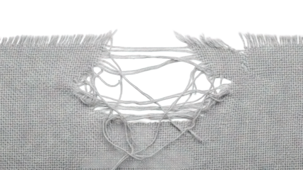 Torn gray fabric with a large hole revealing white background.