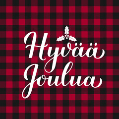 Hyv&auml;&auml; Joulua calligraphy hand lettering on red buffalo plaid background. Merry Christmas typography poster in Finnish. Vector template for greeting card, banner, flyer, etc.