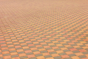The road surface is in an orange-brown cage, made of interlacing tiles.