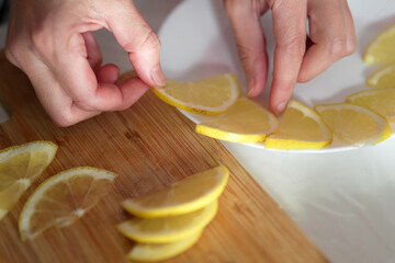 Creating a sunny lemon arrangement on a plate with citrus slices on a cutting board