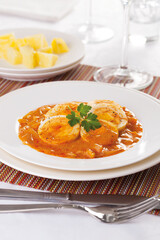 Vegetable stew with boiled egg, served with boiled potatoes.