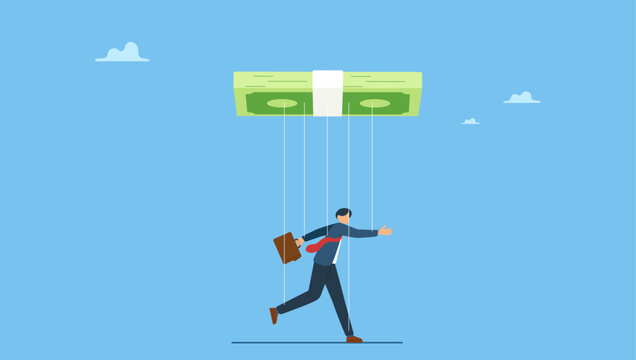 Businessman puppet doll being controlled by money. Being controlled by money, capitalism, greedy working environment, slavery, decision manipulation or bribery and corruption.