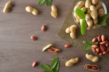 Peanut in glass bowls on wooden kitchen bench top view