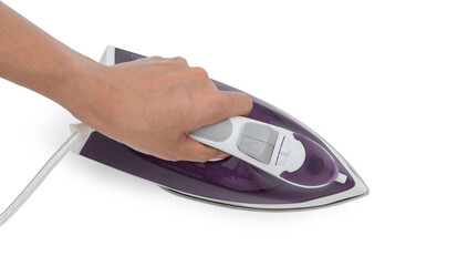 topview hand holding purple electric iron placed on isolated white background