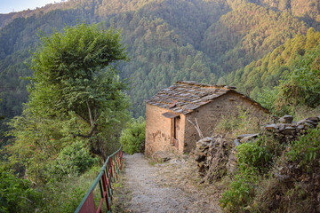 Mountain side village cow shed made of mud and stones.