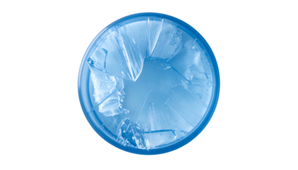 Overhead view of shattered, translucent blue glass within a circular frame, against black background