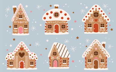 Fototapeta premium Set of cute gingerbread houses decorated with icing, candy, and snow. Christmas and winter holiday illustration in flat style on light blue background with stars and snowflakes. Cozy festive design