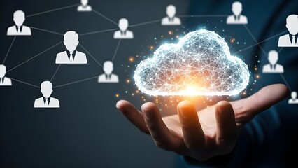 Close-up of a hand holding a glowing cloud icon with network connections and user silhouettes on a dark background.