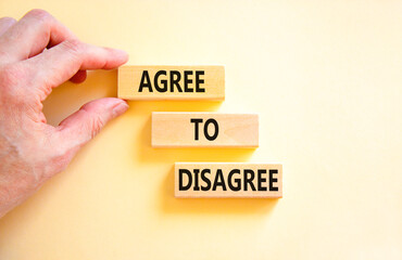 Agree to disagree symbol. Concept words Agree to disagree on beautiful wooden block. Businessman's hand. Beautiful white background. Business and agree to disagree concept. Copy space.