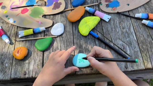 Focused Little Children Painting Stone with Bright Acrylic Colors During Creative Art Activity at Home DIY Craft Project for Kids, Childhood Learning and Fun Indoor Hobby Concept