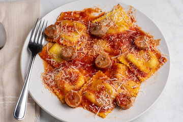 spinach and mushroom ravioli top with chicken sausage