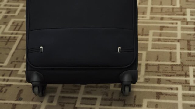  Suitcase moves along the hotel corridor. Concept of trip and business trip. High quality 4k footage