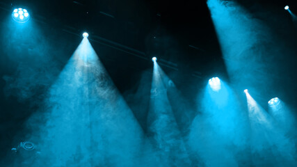 Blue Stage Light On Concert Stage Through Smoke