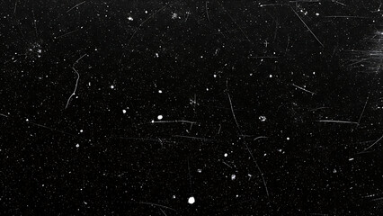 Black background with white specks and scratches