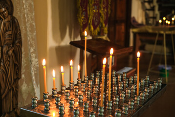 Lit candles in the Orthodox Church.