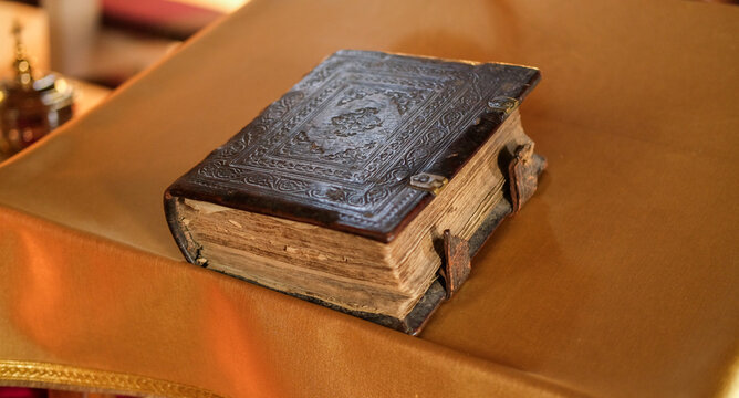 Hardcover Holy Bible on the table, top view. Orthodox Church.