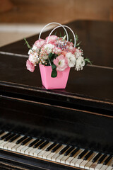 Flower Basket on Elegant Black Piano