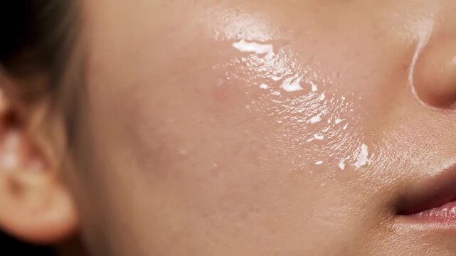 Close-up of radiant, hydrated human skin with visible moisture, showcasing a healthy and refreshed glow after a workout or skincare routine