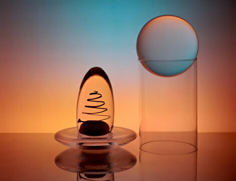 Different glass items with colorful lighting