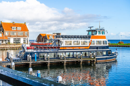 Volendam, Netherlands - October 27, 2025: Marken Boat Tour ship on embankment. Old Dutch port. Holland harbor express