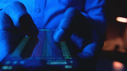 Businessman's hands scrolling through a financial trading application on a mobile phone at night - Powered by Adobe