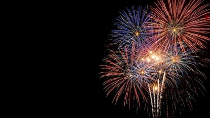 Fototapeta premium Spectacular Fireworks Display Celebrating New Year’s Eve at City Park, Nighttime Celebration, Aerial View, Vibrant Atmosphere