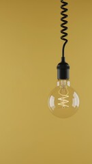 Bright Ideas and Innovation Concept - Transparent Light Bulb with Filament on Mustard Yellow Background