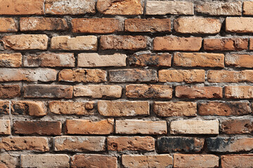 Obraz premium weathered red brick wall texture with rough mortar
