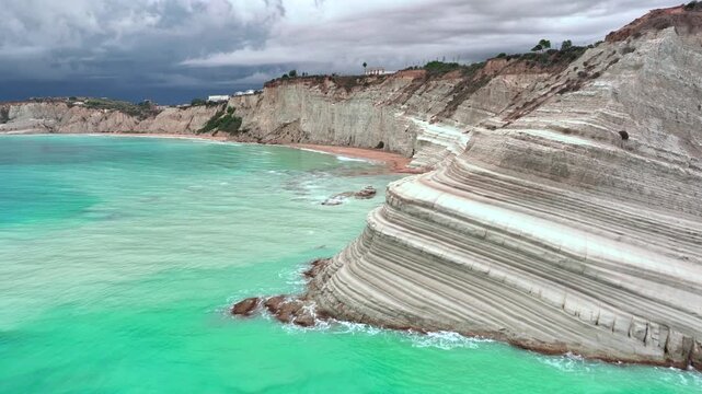 Scala dei Turchi, or the Turkish stairs in Sicily, Italy. Aerial Drone Shot. Unique White Rocks and Turquoise water.