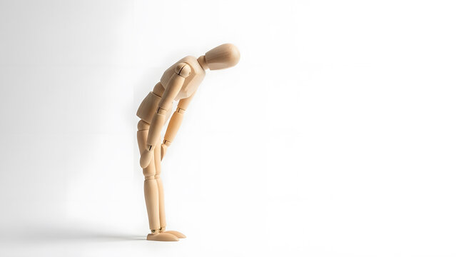 深々と頭を下げて謝罪やお礼をするデッサン人形