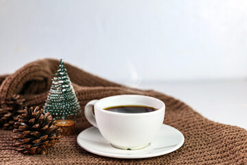 Cozy winter Coffee with pine cones and Chistmas tree decorationv