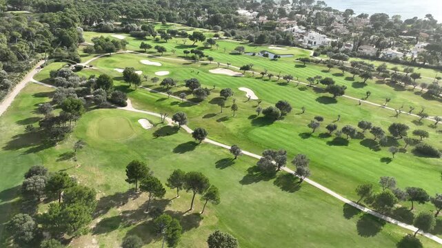 Aerial view, Spain, Balearic Islands, Mallorca, Capdepera, Cuevas de Arta and Platja de Canyamel with golf course, sand bunker, green, golfer