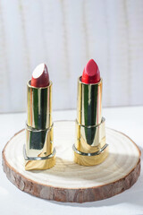 red lipstick on wooden plate