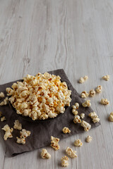 Homemade Salty Popcorn in a Bowl, side view. Copy space.