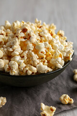 Homemade Salty Popcorn in a Bowl, low angle view. Close-up.