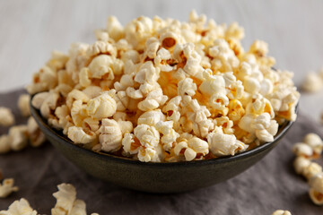 Homemade Salty Popcorn in a Bowl, low angle view. Close-up.