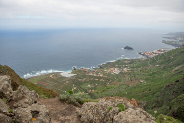 Garachico, Tenerife, Spain - Panoramic view of the coastline with lush greenery and the ocean in the background, showcasing the beauty of nature